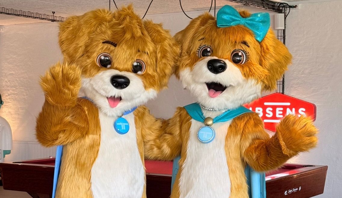 Two puppy mascots of Treysti and Tita from the front