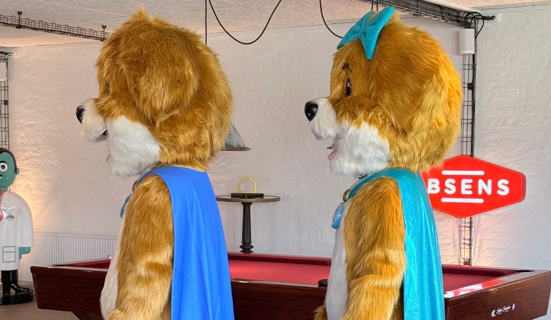 Two puppy mascots of Treysti and Tita from the side